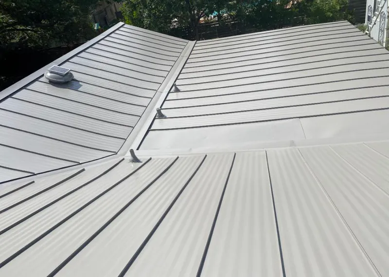 Solar attic fan installed on a metal roof for Roof Ventilation in Yorktown